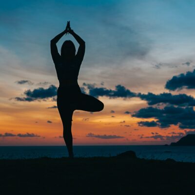 A woman doing yoga at a wellness retreat.