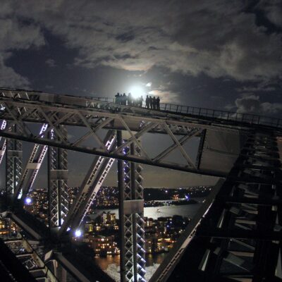 Climbing the Sydney Harbour Bridge at night.
