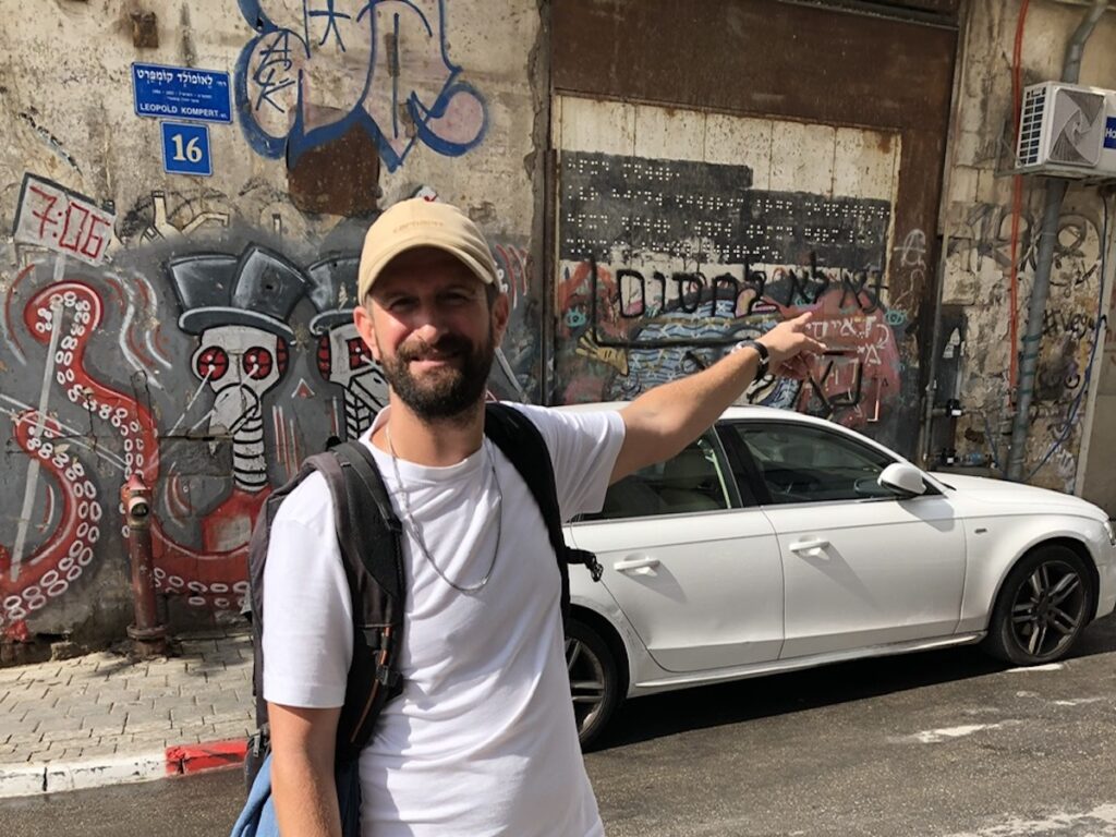 Eviatar leading a graffiti tour of the Florentine neighborhood in Tel Aviv
