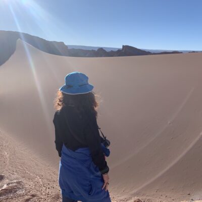 The author admiring a view across a dune in Chile.