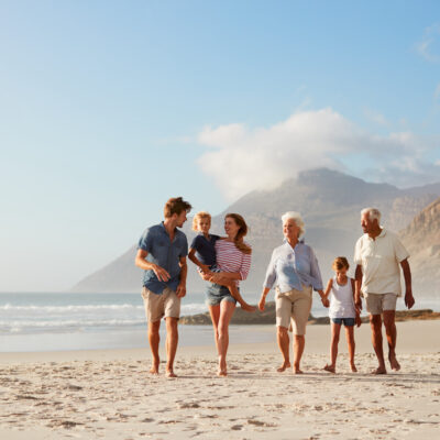 grandparents, parents, and kids on vacation at a beach