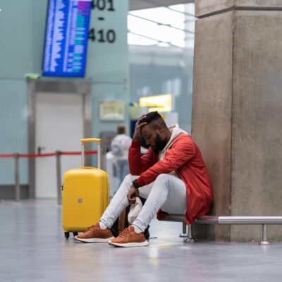 Sad man sitting at the airport