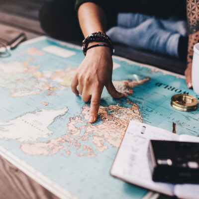 travel agent planning trip with map, coffee