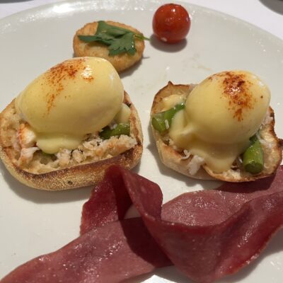 traditional eggs Benedict with Dungeness crab and asparagus