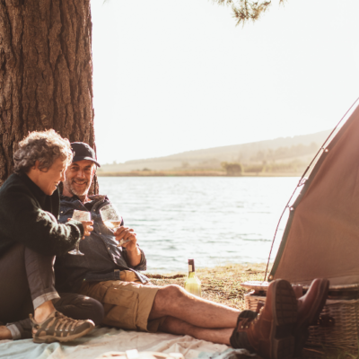 mature couple camping by lake