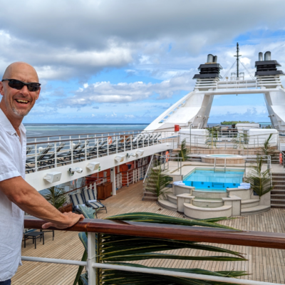 bald man wearing sunglasses on cruise ship